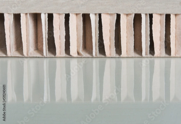 Obraz Thick cardboard spacer with vertical bars and reflection