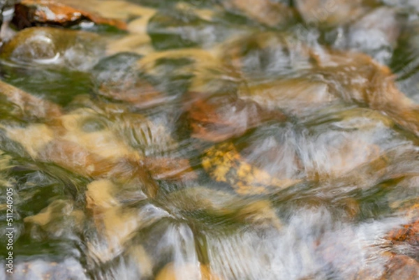 Obraz Water flows over the cobblestones. Texture