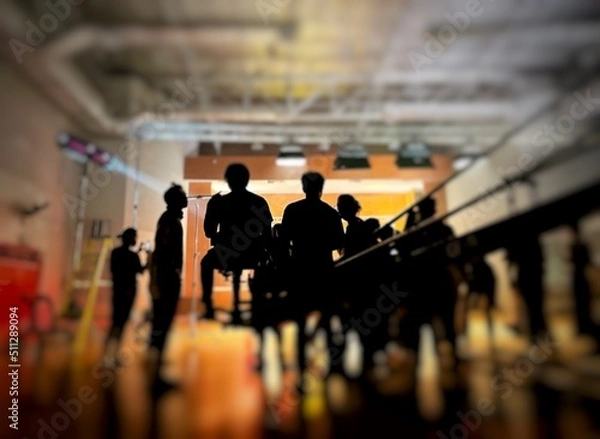 Obraz Behind the scenes of music video shooting production crew team silhouette and camera equipment in studio. 