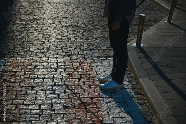 Fototapeta Close-up Of A Blind Man Standing With White Stick On Street