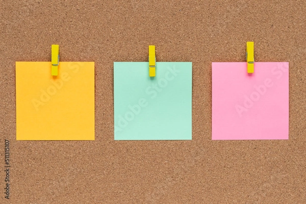 Obraz Three multicolor sticky notes on cork bulletin board, reminder important information. Blank square paper, modern template, frame. Planning concept.