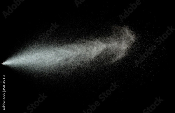 Obraz Sprayed water. Splashes and drops of water isolated on black background.