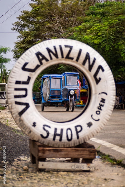 Fototapeta Tuk tuk in a tire on a philippine island Siargao