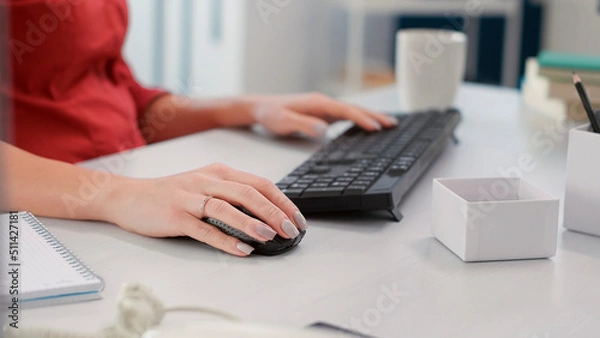 Fototapeta Sales consultant planning business charts statistics on computer, working with e commerce reports. Executive assistant analyzing data research diagrams. Handheld shot. Close up.