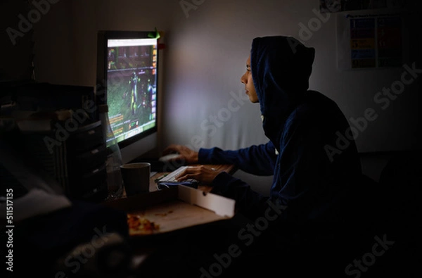 Fototapeta Working on a new game. Cropped shot of a young programmer focused on his work.