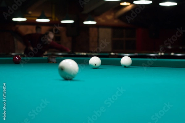 Obraz Russian billiards in club: white balls on green table cloth