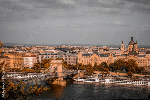 Fototapeta Chain bridge over the Danube river in Budapest. Hungary. Autumn cityscape with old buildings and opera domes