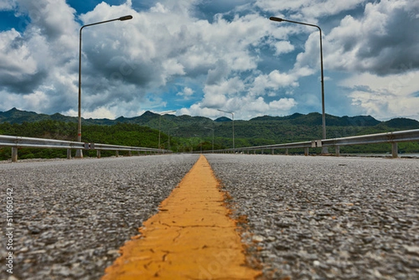 Fototapeta An ant perspective view looking to the mountain and clear blue sky.