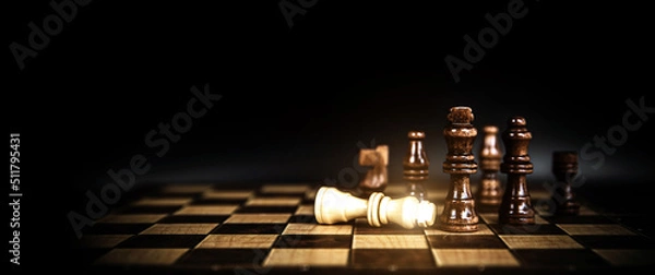 Obraz Close-up king chess stand on falling chess concepts of competition challenge of leader business team or teamwork volunteer or wining and leadership strategic plan and risk management or team player.