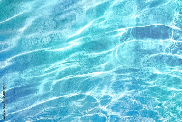 Obraz Beautiful turquoise blue ocean water surface with light reflections and highlights. Texture of water close-up macro.