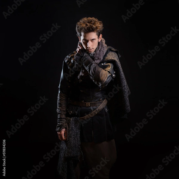 Fototapeta A guy in a steampunk or post-apocalyptic image, portrait on a black background
