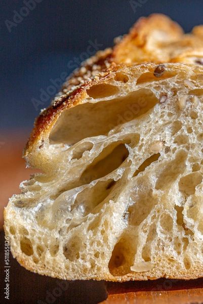 Obraz Bread macro. Bread pores. Fresh baguette with grains macro.Bakery advertisement. Seeds in bread. Freshly baked bread. French baguette cut. Fresh bakery. Bun in a cut. Baking from the oven. Bakery