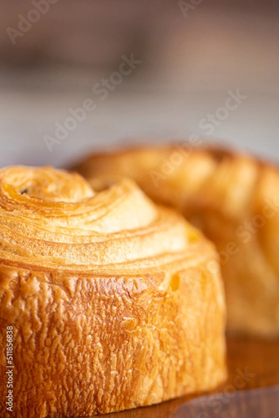 Obraz Croissant macro. French croissant with waves. Air baking. Croissant for puff pastry advertising. Croissant for a magazine.French breakfast with pastries. From puff pastry. Bun from France. Roll macro