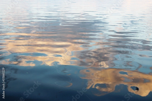 Fototapeta clouds are reflected in the water of the river