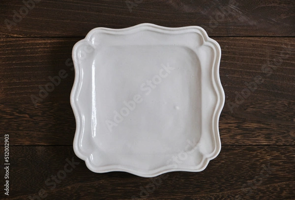 Obraz 陶器の皿と木目の背景