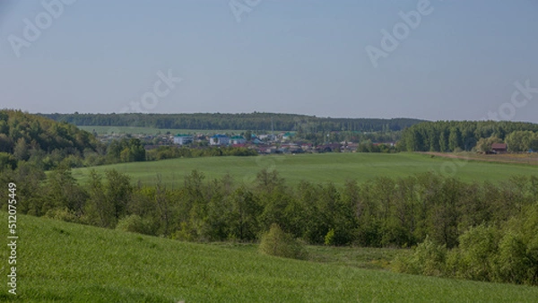 Fototapeta view of the village of Kalmash, Tatarstan, Russia, spring agricultural fields from the top of the hill on a spring clear morning