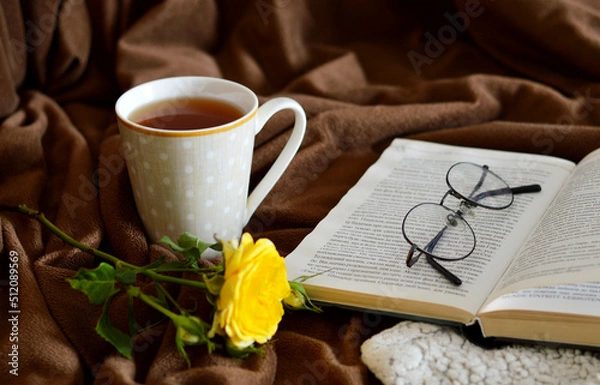 Fototapeta Open book and tea