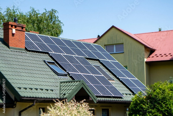 Obraz Historic farm house with modern solar panels on roof and wall High quality photo