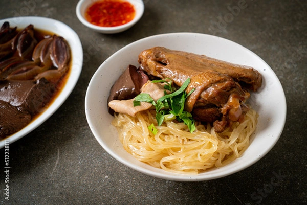 Fototapeta dried noodles with braised duck in white bowl