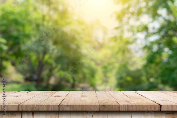 Obraz Wooden table and blurred green nature garden background with copy space