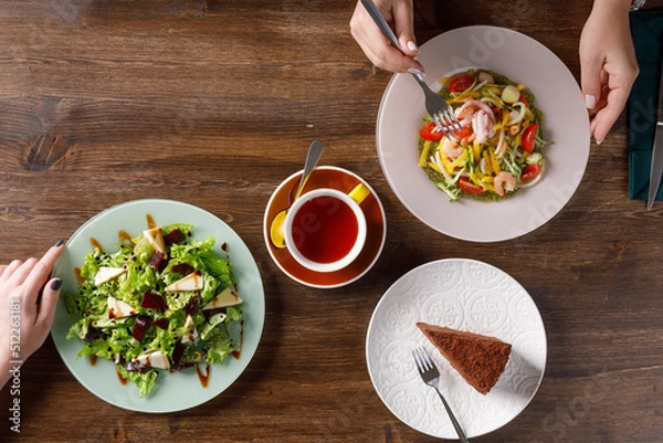 Obraz Overhead view of food on table with two people