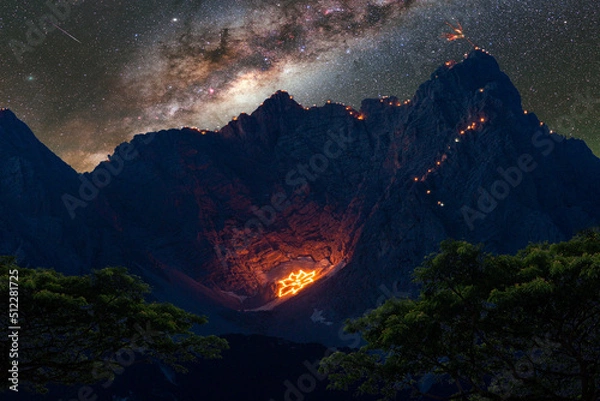 Obraz Amazing night in the mountains with burning fires at high alpine terrain with stars and astro milkiway on a burning man event.