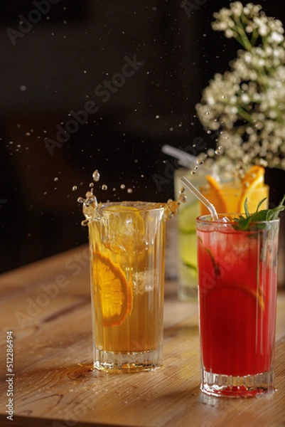 Fototapeta lemonade in a tall glass cup. bright colors, summer mood