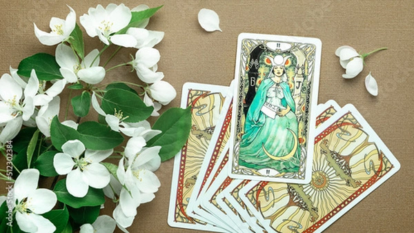 Fototapeta Blurred Tarot cards layout on witch table. Esoteric concept and astrology