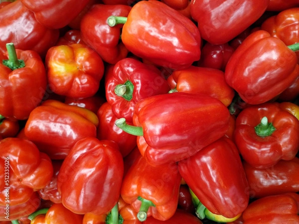 Fototapeta Top view of a red bell peppers in a tray 