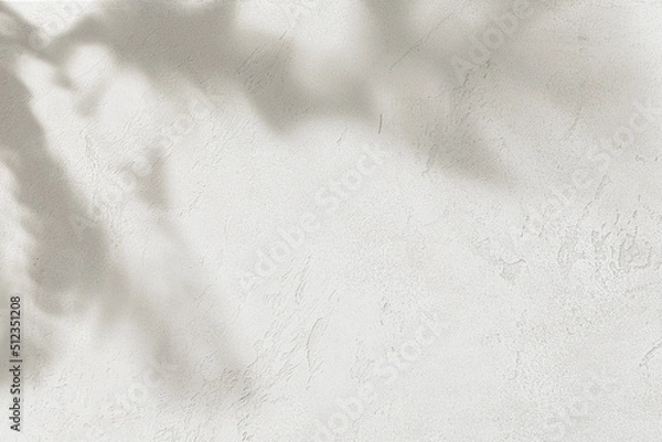 Fototapeta Rough concrete wall with tropical leaves shadow. Abstract background texture