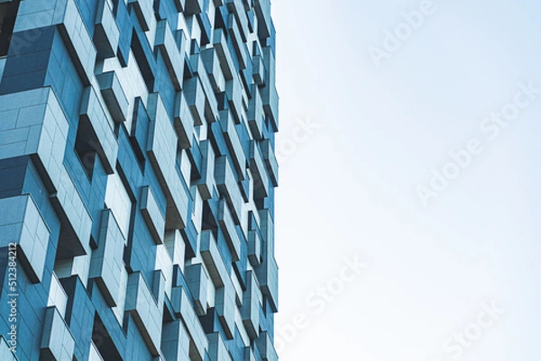 Fototapeta underside panoramic and perspective view to steel blue glass high rise building skyscrapers, business concept of successful industrial architecture
