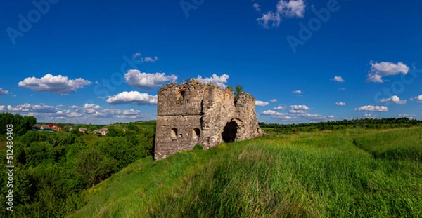 Fototapeta Remains and ruins of an old castle in Europe. UNESCO heritage in the Ukrainian village Sutkivtsi.