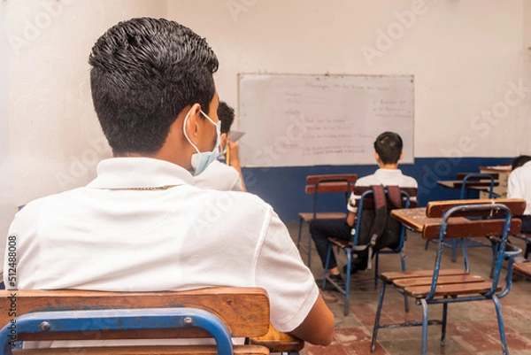 Fototapeta Nicaraguan students in a classroom about to start a test