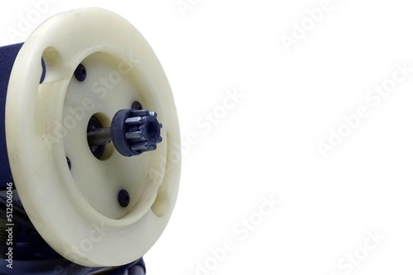 Fototapeta A angle side view of a gear of a drive motor on white bakgrounds. 