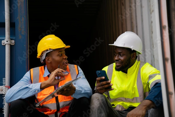 Fototapeta African American working engineer foreman talk while taking a break