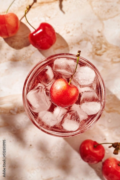 Obraz refreshing lemonade with ice and cherries