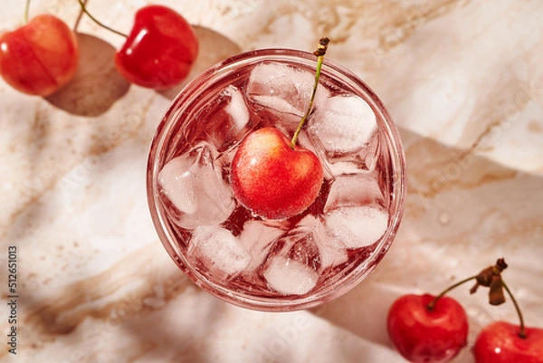 Obraz refreshing lemonade with ice and cherries