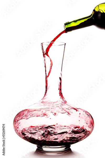 Obraz Red wine being poured in a decanter