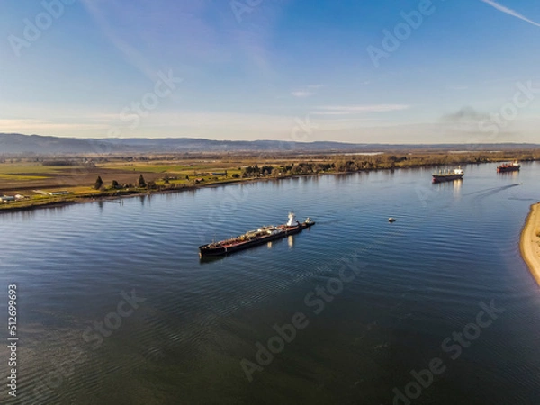 Fototapeta Barge on the Columbia river, heading to the Willamette river confluence