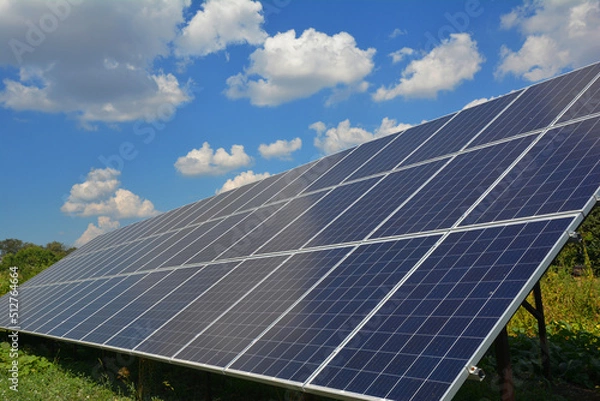 Obraz Solar panels againt blue sky and beautiful cloudscape with copy space.