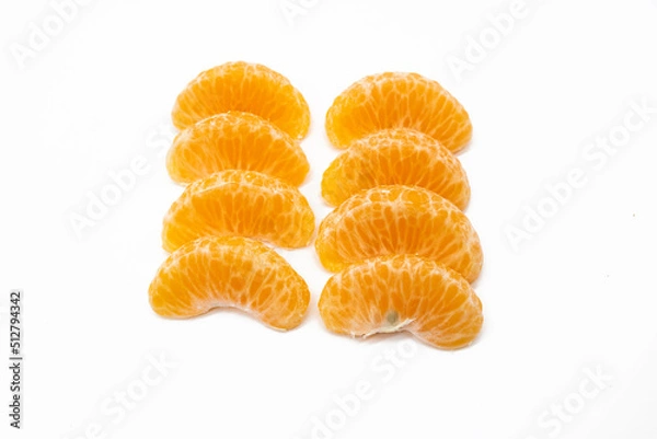 Fototapeta some pieces of tangerine isolated on white background