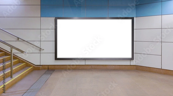 Fototapeta Horizontal mock up of blank advertising billboard poster template next to a flight of stairs; out-of-home OOH media display space mockup in pedestrian underpass; digital display in train station.