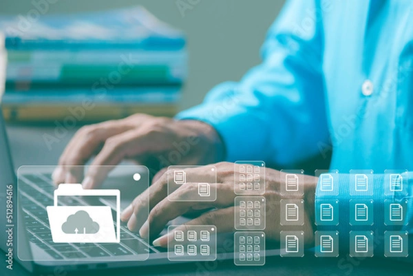Fototapeta Young businessman working in front of computer