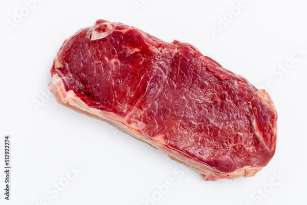 Fototapeta Fresh raw steaks on white background.