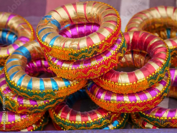 Obraz Colorful designer Head Carrying Ring, Support for Head Loads of carrying water pot in village