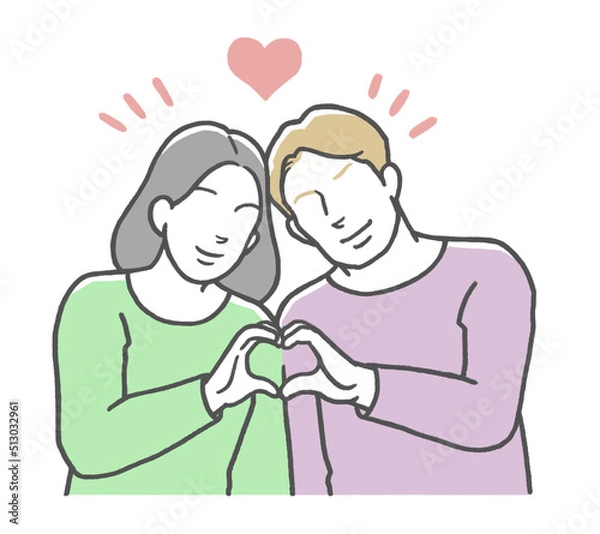 Fototapeta 手でハートマークを作る国際カップル　西洋人男性とアジア人女性