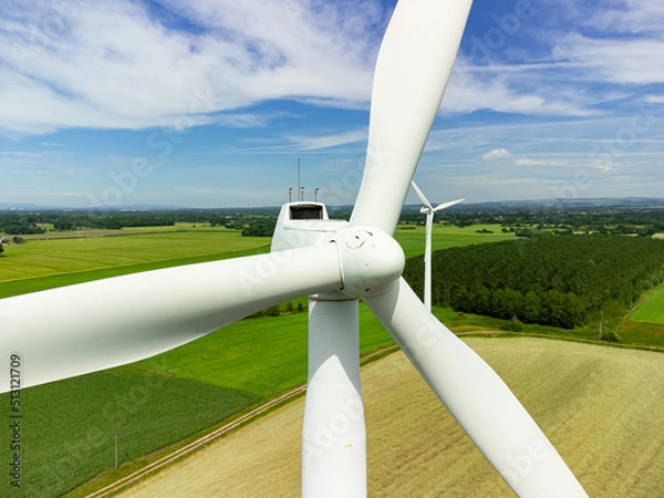 Obraz Close up aerial view of a wind turbine in a small rural wind farm in the English countryside