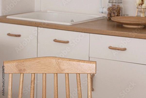 Fototapeta Modern Kitchen interior design with wooden chair.