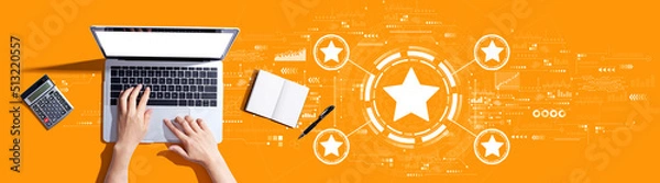 Fototapeta Rating star concept with person using a laptop computer