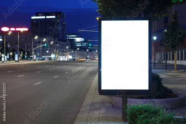 Obraz Vertical billboard advertising in the night city. Begins to dawn. Mock-up.